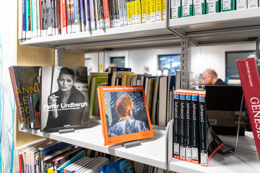 Close-up of photography books on display in the Easterhouse campus library at Glasgow Kelvin College, including titles like Peter Lindbergh and Women Street Photographers.