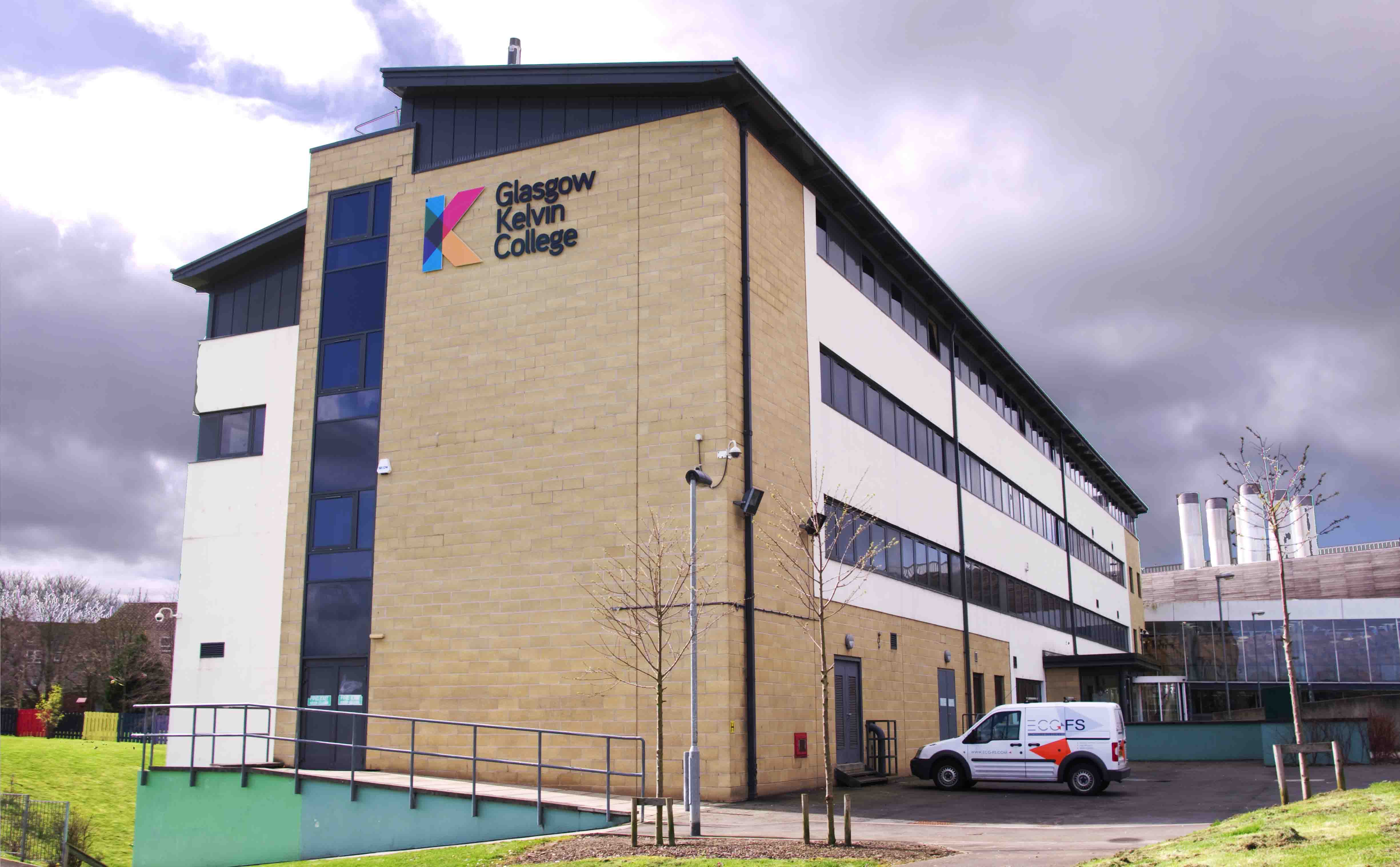Exterior view of Glasgow Kelvin College Easterhouse Campus, showing the modern building and surrounding landscape.